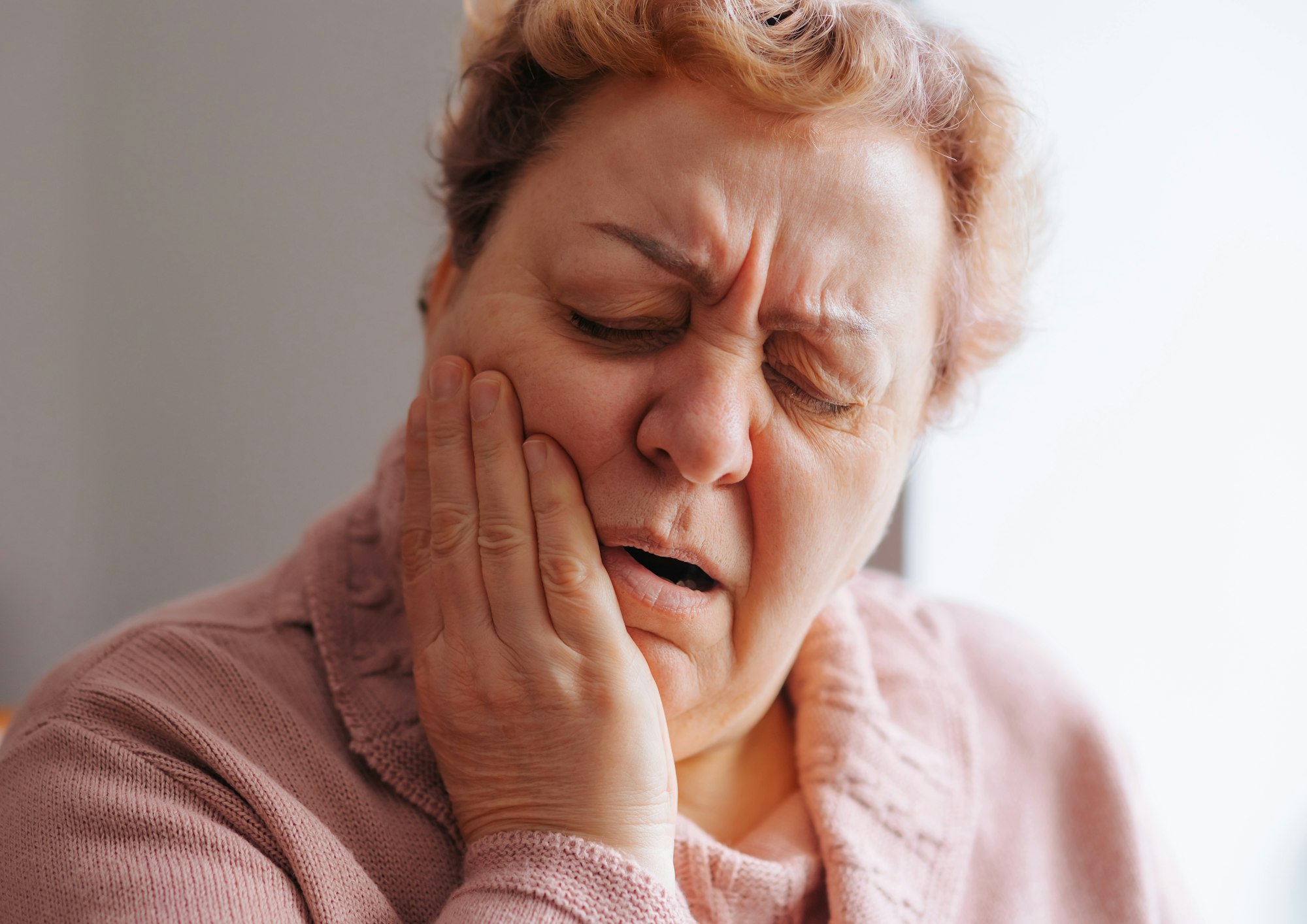 The Struggle of Tooth Pain Authentic Elderly Woman in Discomfort